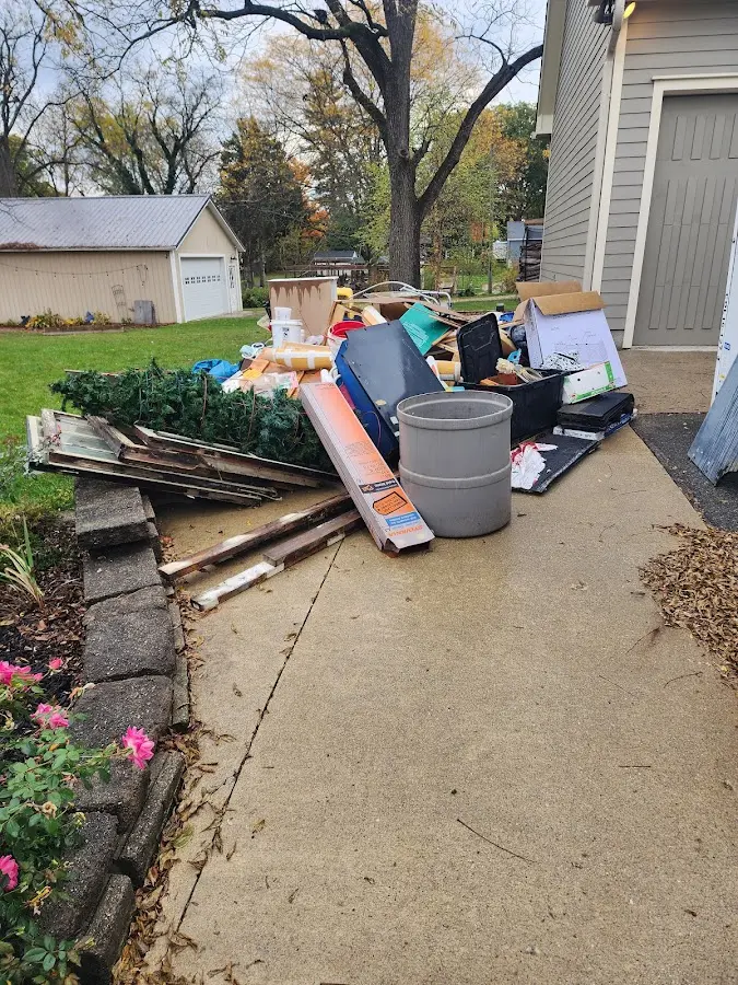 Dumpster being loaded with debris for Demolition Dumpster Rental in Happy Valley